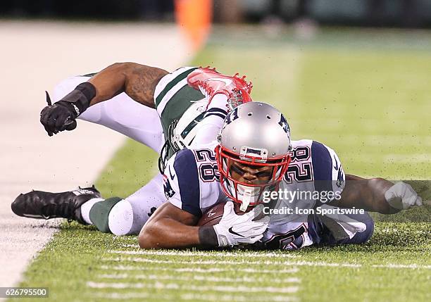 New York Jets Linebacker Darron Lee tackles New England Patriots Running Back James White during the 4th Quarter of an NFL football game between the...