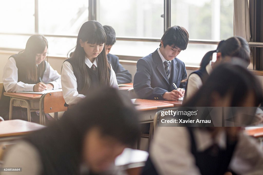High school students studying in classroom