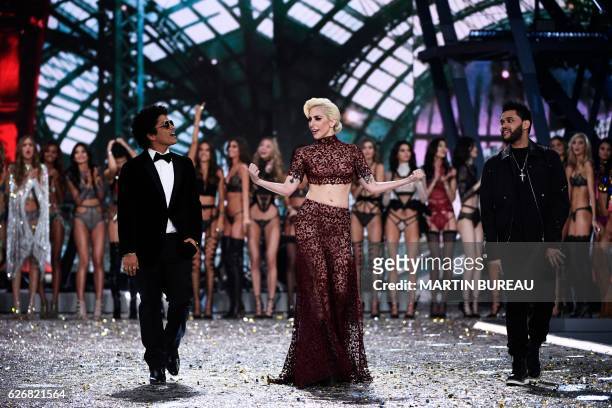 Singer Lady Gaga performs with US singer Bruno Mars and Canadian singer/songwriter The Abel Tesfaye a.k.a The Weeknd during the 2016 Victoria's...
