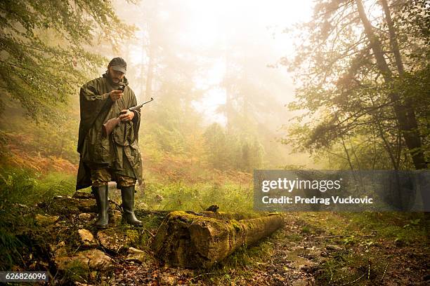 hunter in the forest - woodland camo stock pictures, royalty-free photos & images