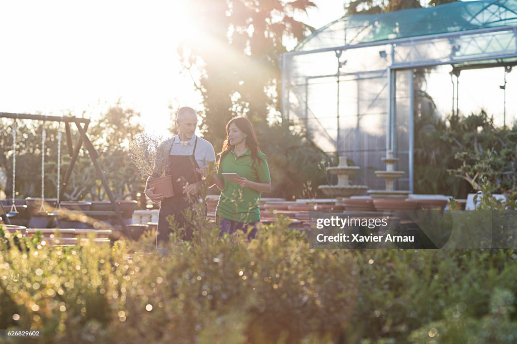 Man and woman discussing at garden center