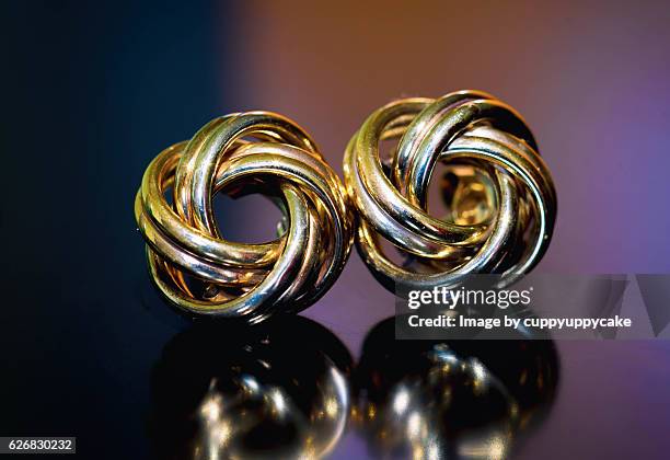 gold knot earrings - earrings stock pictures, royalty-free photos & images