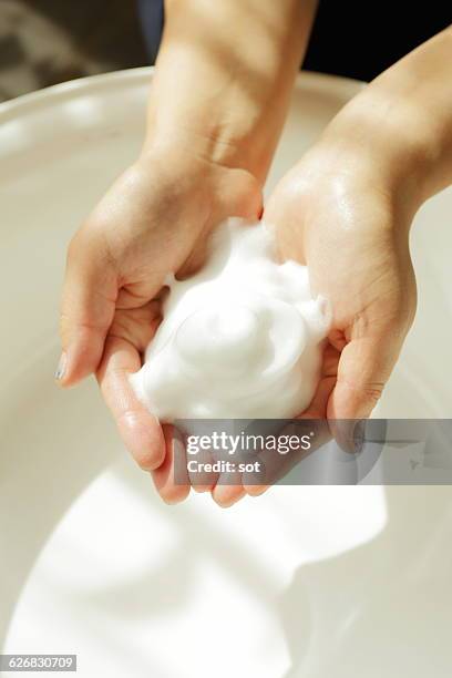 hands of woman with bubbles of soap,close up - wash bowl imagens e fotografias de stock