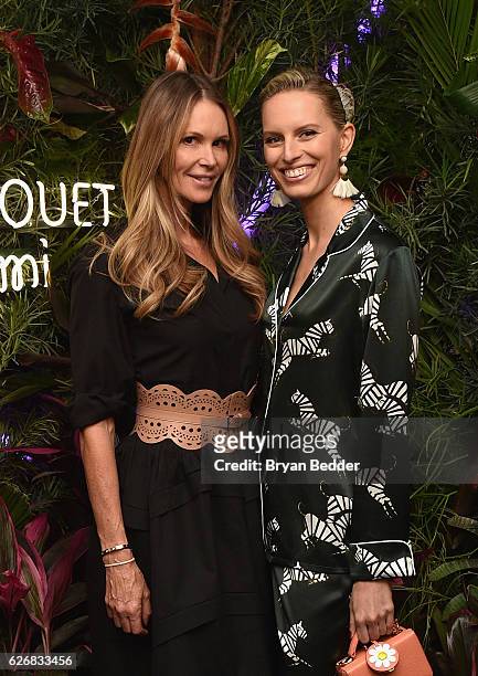 Models Elle Macpherson and Karolina Kurkova attend the L'Eden By Perrier-Jouet Rooftop Soiree With Karolina Kurkova on November 30, 2016 in Miami...