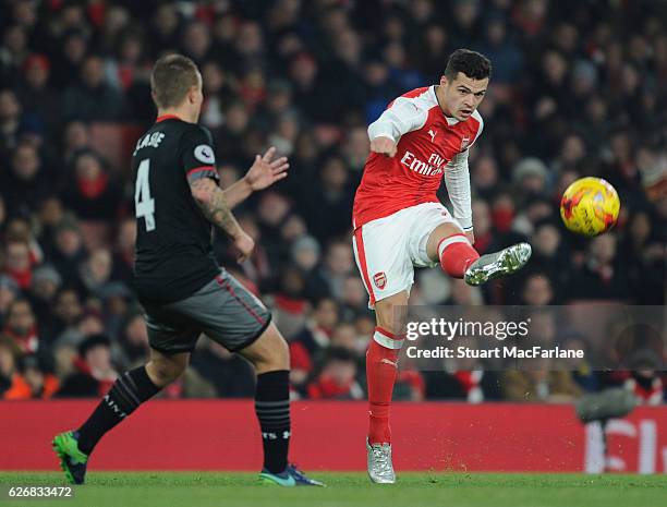 Granit Xhaka of Arsenal takes on Jordy Clasie of Southampton during the EFL Quarter Final Cup match between Arsenal and Southampton at Emirates...