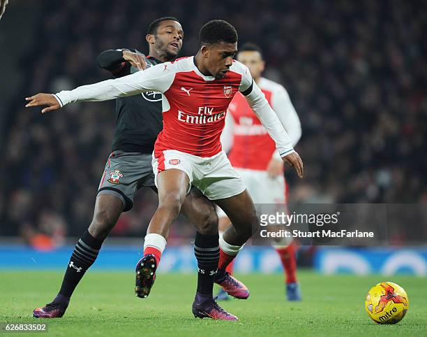 Alex Iwobi of Arsenal takes on Cuco Martina of Southampton during the EFL Quarter Final Cup match between Arsenal and Southampton at Emirates Stadium...