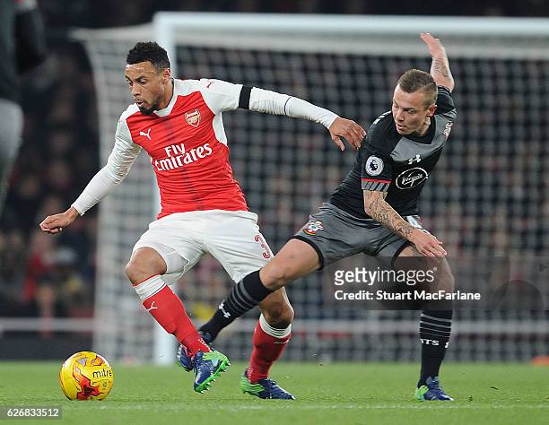 Francis Coquelin of Arsenal takes on Jordy Clasie of Southampton during the EFL Quarter Final Cup match between Arsenal and Southampton at Emirates...