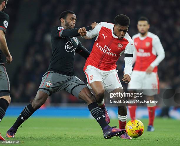 Alex Iwobi of Arsenal takes on Cuco Martina of Southampton during the EFL Quarter Final Cup match between Arsenal and Southampton at Emirates Stadium...