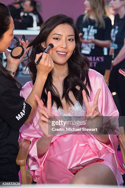 Model Liu Wen prepares before the 2016 Victoria's Secret Fashion Show at Le Grand Palais in Paris on November 30, 2016 in Paris, France.