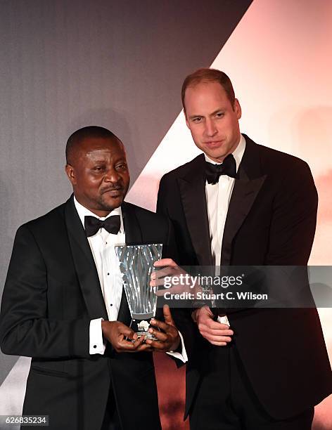 Prince William, Duke of Cambridge presents John Kahekwa with the Conservation for Africa Award during the Tusk Trust Awards at Victoria & Albert...