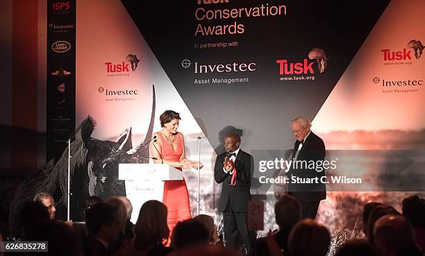 Manuel Sacaia receives a conservation in Africa award from Kate Silverton and Sir David Attenborough during the Tusk Trust Awards at Victoria &...