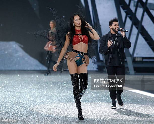 Adriana Lima walks the runway as The Weeknd performs during the 2016 Victoria's Secret Fashion Show at Le Grand Palais on November 30, 2016 in Paris,...