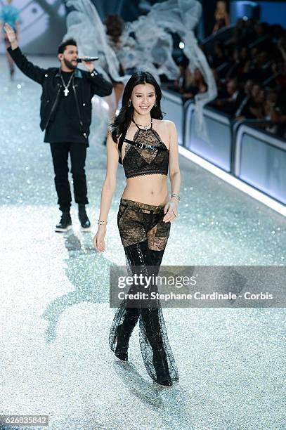 Singer The Weeknd and model Ming Xi on the runway for the 2016 Victoria's Secret fashion show at Le Grand Palais on November 30, 2016 in Paris,...