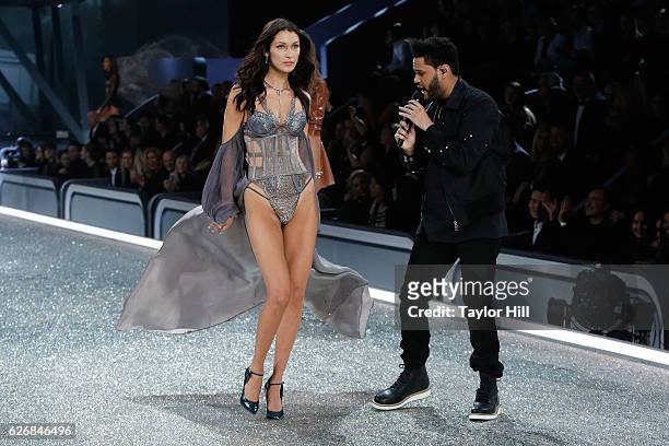 The Weeknd performs as Bella Hadid walks the runway during the 2016 Victoria's Secret Fashion Show at Le Grand Palais on November 30, 2016 in Paris,...