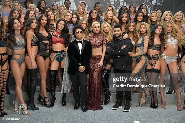 Bruno Mars, Lady and The Weeknd pose with Victoria's Secret models backstage during 2016 Victoria's Secret Fashion Show on November 30, 2016 in...