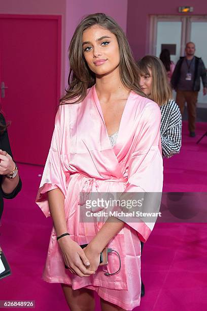 Model Taylor Hill prepares before the 2016 Victoria's Secret Fashion Show at Le Grand Palais in Paris on November 30, 2016 in Paris, France.