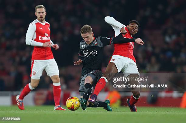 Steven Davies of Southampton and Jeff Reine-Adelaide of Arsenal during the EFL Quarter Final Cup match between Arsenal and Southampton at Emirates...