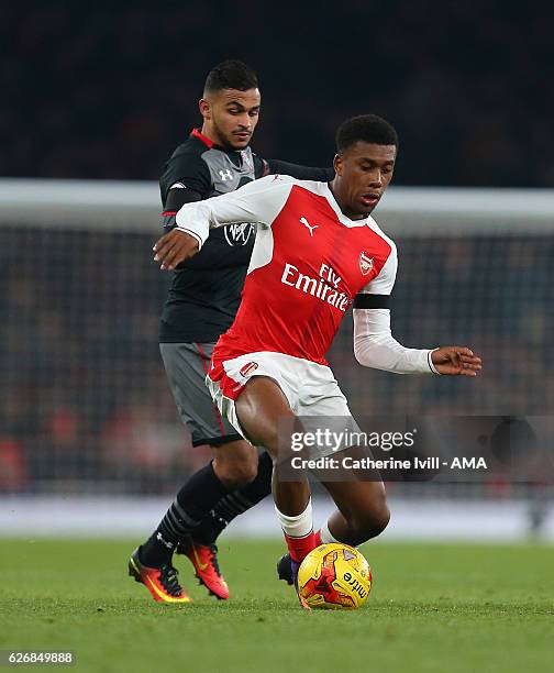 Sofiane Boufal of Southampton and Alex Iwobi of Arsenal during the EFL Quarter Final Cup match between Arsenal and Southampton at Emirates Stadium on...