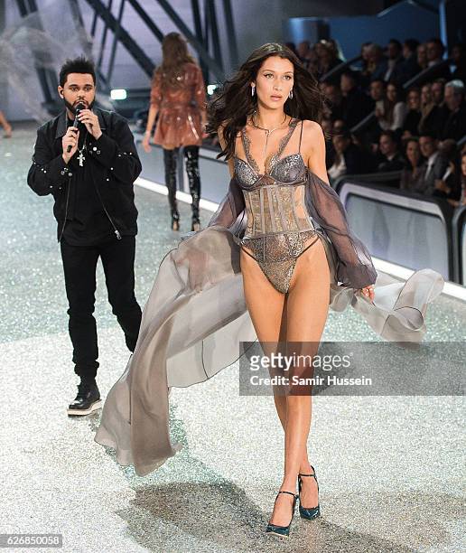 Bella Hadid walks the runway as The Weeknd performs during the annual Victoria's Secret fashion show at Grand Palais on November 30, 2016 in Paris,...