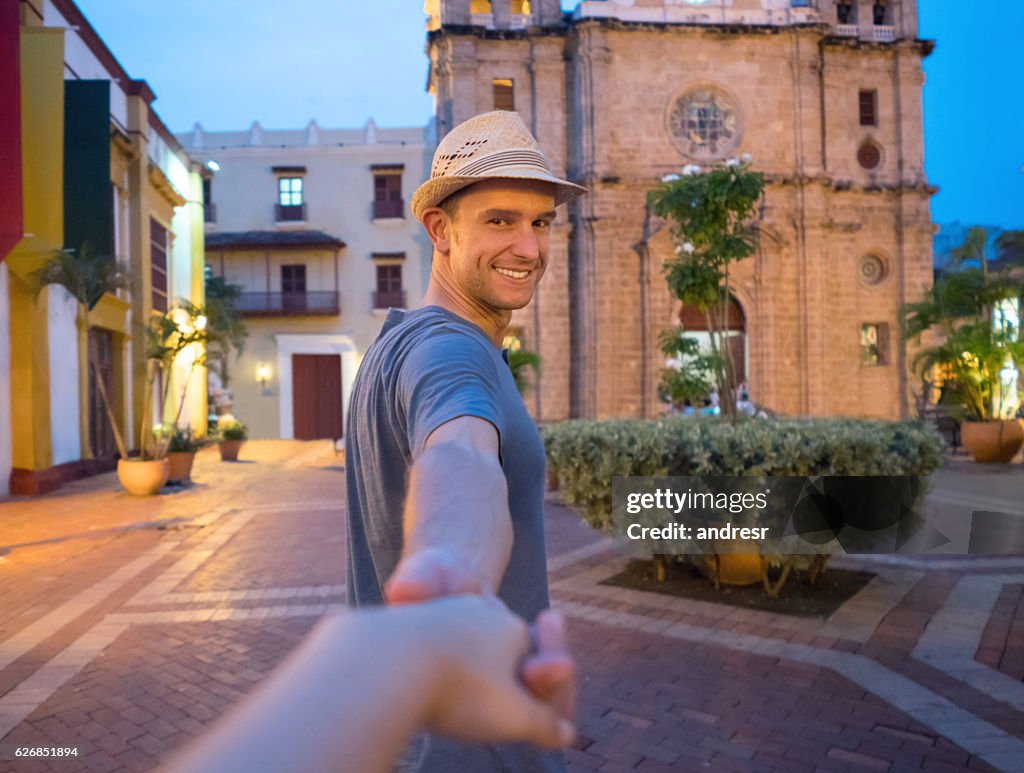 Couple holding hands and traveling together