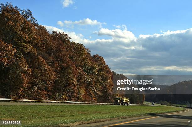 semi truck on a rural highway - marietta ohio stock pictures, royalty-free photos & images