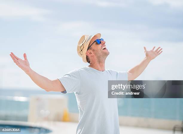 happy man enjoying his holidays - happy holidays around the world stock pictures, royalty-free photos & images