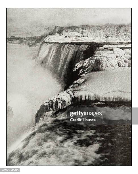 antique photograph of niagara falls in winter - niagara falls city ontario stock illustrations