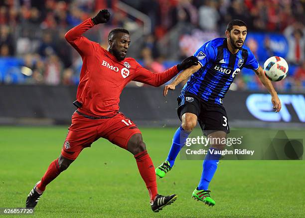 Jozy Altidore of Toronto FC battles for the ball with Hernn Bernardello of Montreal Impact during the first half of the MLS Eastern Conference Final,...