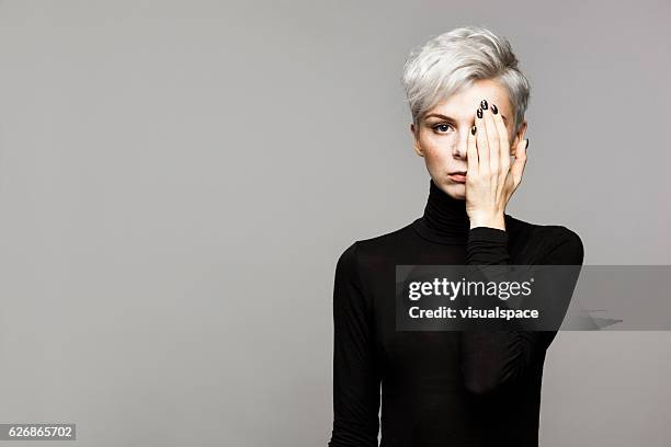 portrait of young woman - covering gray hair stock pictures, royalty-free photos & images