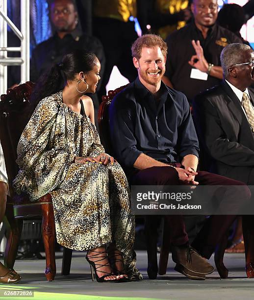 Prince Harry and singer Rihanna attend a Golden Anniversary Spectacular Mega Concert at the Kensington Oval Cricket Ground on day 10 of an official...
