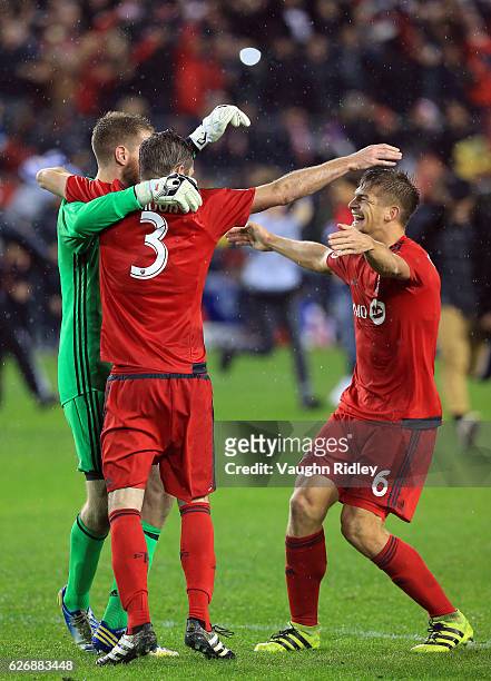 Drew Moor of Toronto FC celebrates with Clint Irwin and Nick Hagglund at the final whistle following the MLS Eastern Conference Final, Leg 2 game...