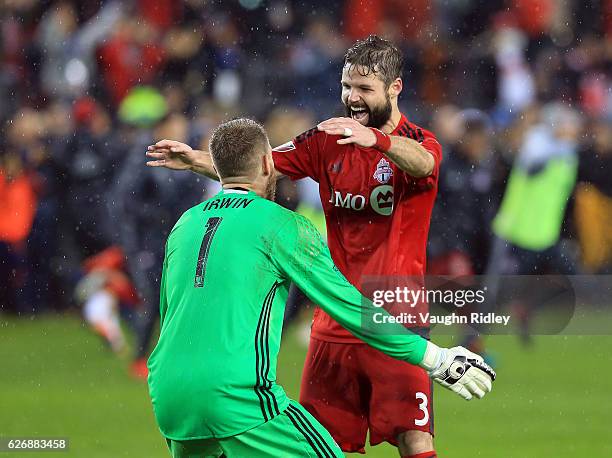 Drew Moor of Toronto FC celebrates with Clint Irwin at the final whistle following the MLS Eastern Conference Final, Leg 2 game against Montreal...