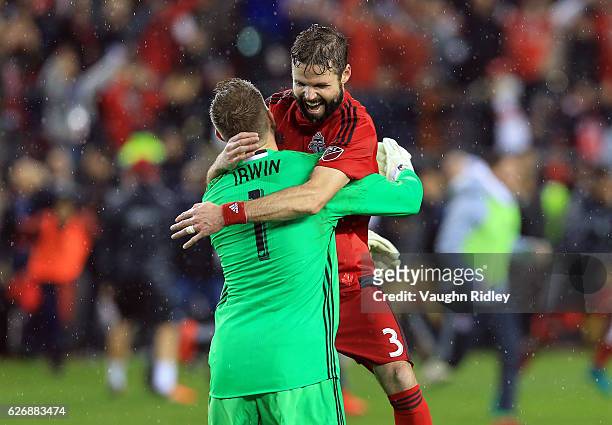 Drew Moor of Toronto FC celebrates with Clint Irwin at the final whistle following the MLS Eastern Conference Final, Leg 2 game against Montreal...