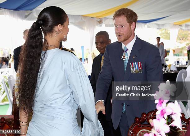 Prince Harry meets Rihanna at a Toast to the Nation Event on day 10 of an official visit to the Caribbean on November 30, 2016 in Bridgetown,...