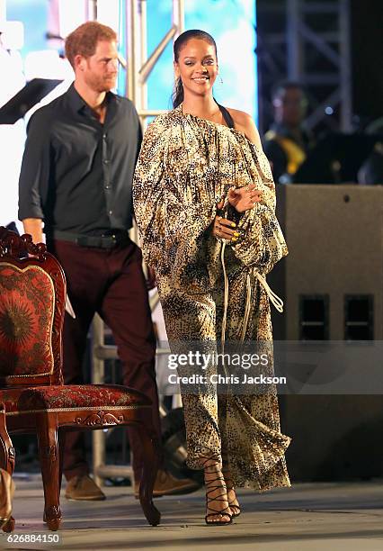 Prince Harry and singer Rihanna attend a Golden Anniversary Spectacular Mega Concert at the Kensington Oval Cricket Ground on day 10 of an official...