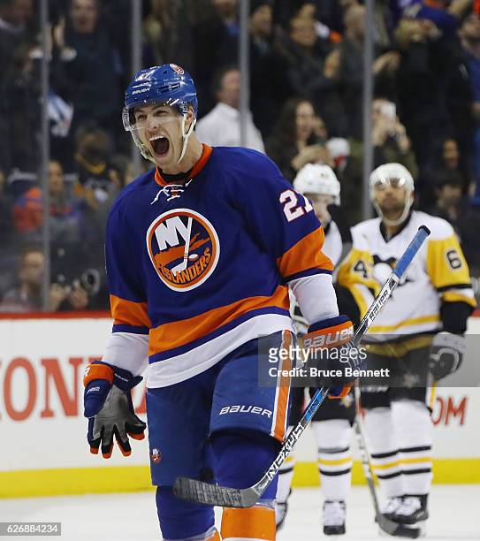 Anders Lee of the New York Islanders celebrates his game winning goal at 19:33 of the third period against the Pittsburgh Penguins at the Barclays...
