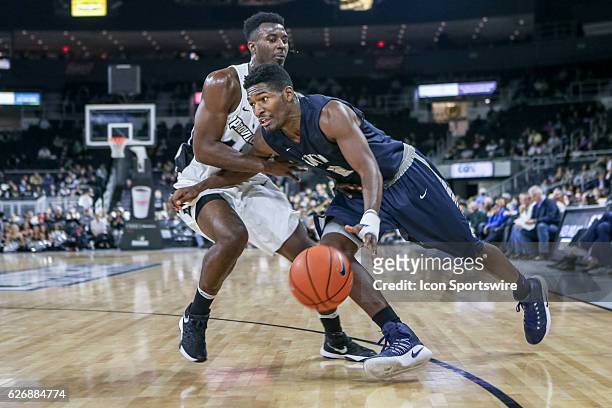 Jaleen Smith Guard for University of New Hampshire drives to the basket during the game between the Providence College Friars and the University of...