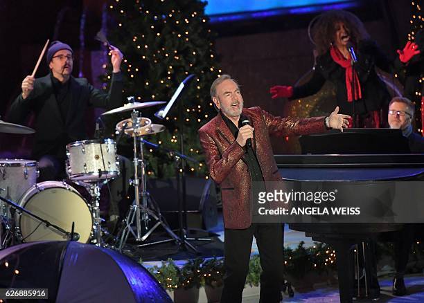Singer Neil Diamond performs at the 84th Annual Rockefeller Center Christmas Tree Lighting Ceremony on November 30, 2016 in New York City. / AFP /...