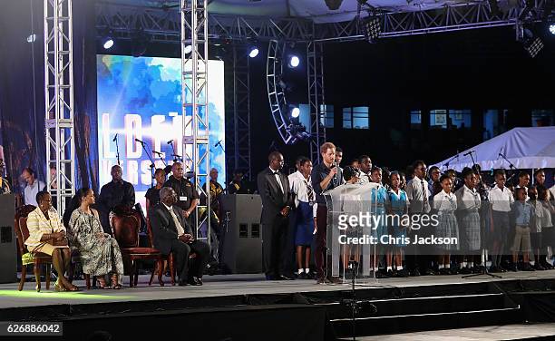 Prince Harry gives a speech as he attends a Golden Anniversary Spectacular Mega Concert at the Kensington Oval Cricket Ground on day 10 of an...