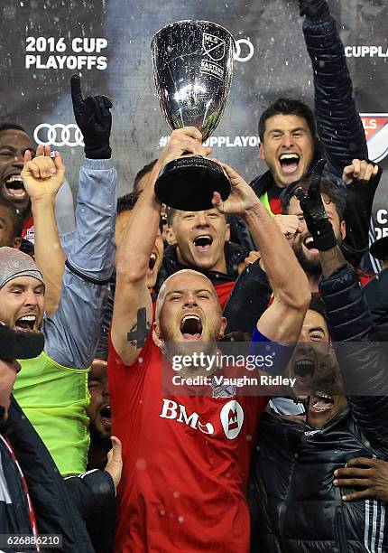 Michael Bradley of Toronto FC and teammates celebrate with the Eastern Conference Trophy following the MLS Eastern Conference Final, Leg 2 game...