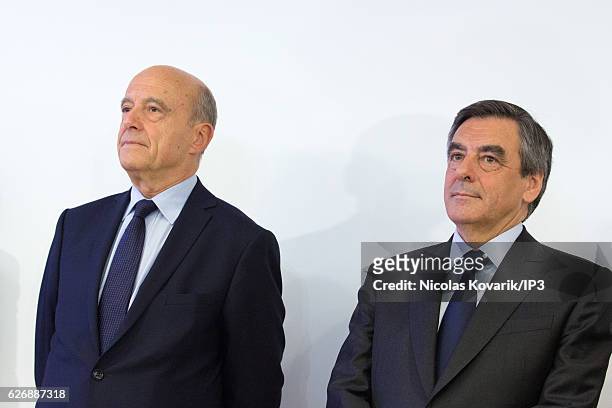 Winner of the Primary Election of the right wing Les Republicains Francois Fillon meets his opponent Alain Juppe to exchange with him an handshake...