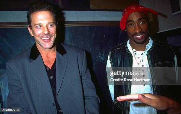 Portrait of actor Mickey Rourke and Rap musician Tupac Shakur as they pose together at benefit auction for Intercambios Culturales Project for El...