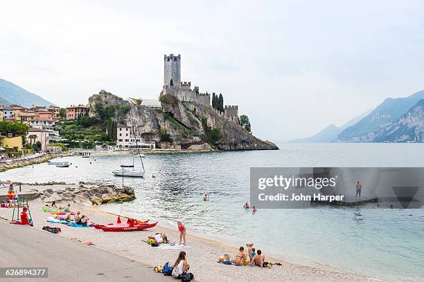 beach in malcesine, lake garda, italy - malcesine stock pictures, royalty-free photos & images