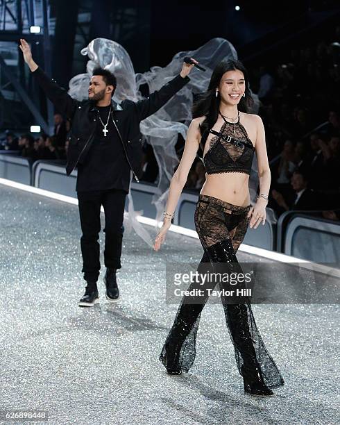 Ming Xi walks the runway as The Weeknd performs during the 2016 Victoria's Secret Fashion Show at Le Grand Palais on November 30, 2016 in Paris,...