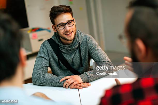 young man at a job interview. - casual job interview stock pictures, royalty-free photos & images