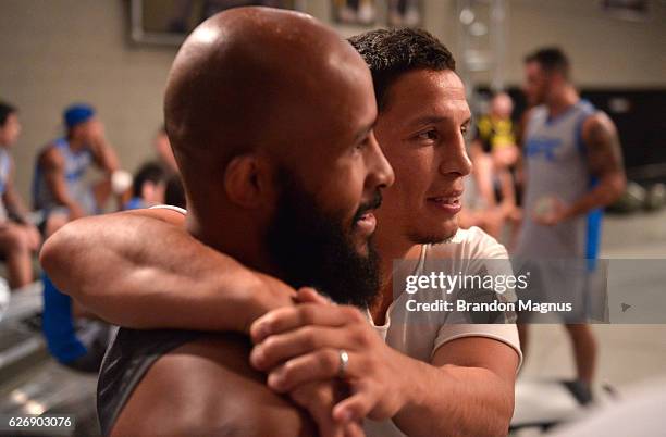 Flyweight champion Demetrious Johnson talks with head coach Joseph Benavidez during the filming of The Ultimate Fighter: Team Benavidez vs Team...