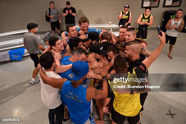 Team Benavidez and Team Cejudo huddle together during the filming of The Ultimate Fighter: Team Benavidez vs Team Cejudo at the UFC TUF Gym on August...