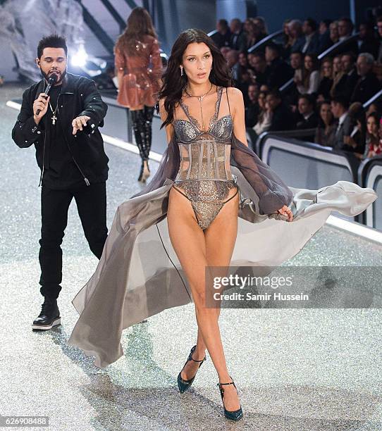 Bella Hadid walks the runway as The Weeknd performs during the annual Victoria's Secret fashion show at Grand Palais on November 30, 2016 in Paris,...
