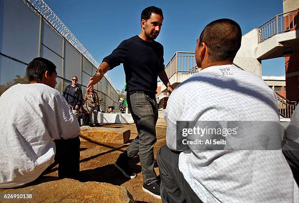 Scott Budnick, center, Producer of the Hangover movies greets incarcerated youth at the Barry J Nidorf Juvenile Hall in Sylmar on October 16 , 2013....