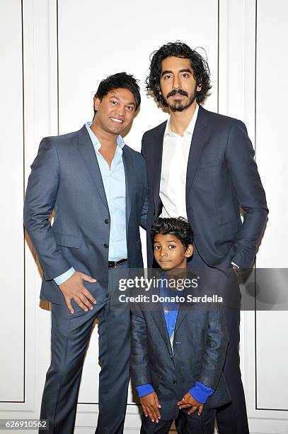 Writer Saroo Brierley and actors Dev Patel and Sunny Pawar wearing Burberry at Burberry and The Weinstein Company honour Dev Patel and his...